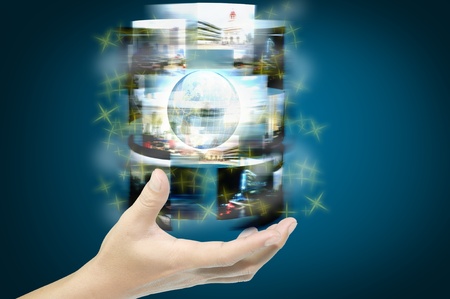 Hand of businessman hold streaming images with earth globeの写真素材