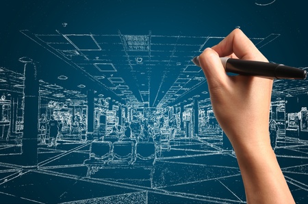 Male Hand drawing building and interior design as architect planの写真素材