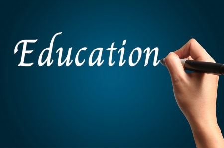 Male Hand write the word "Education"の写真素材