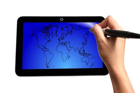 Hand of Business Man Draw World Map on Touch screen of Tablet PCの写真素材