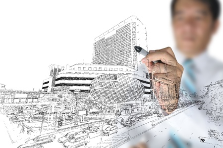 Business man draw modern building and cityscapeの写真素材