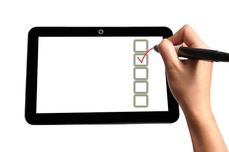 Hand of Business Man Write check mark option and box on Touch screen of Tablet PCの写真素材