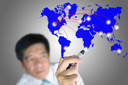 Hand of Business Man Draw Global Network Diagram on Touch screen of Tablet PCの写真素材