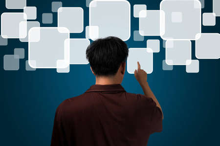 Male hand pushing touch screen interfaceの写真素材