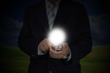 Hand of Business Man Pushing touch screen of mobile smart phoneの写真素材