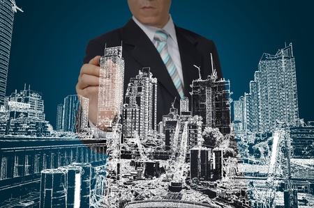 Business Man Drawing building and seascapeの写真素材