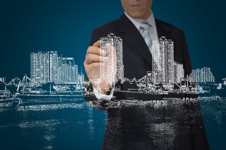 Business Man Drawing building and cityscapeの写真素材