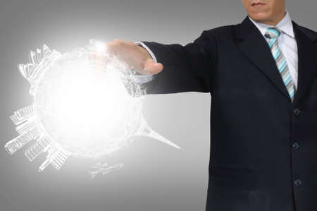 Business Man Touching earth globeの写真素材