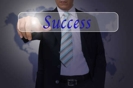 Hand of Business Man Pressing or Pushing Success buttonの写真素材
