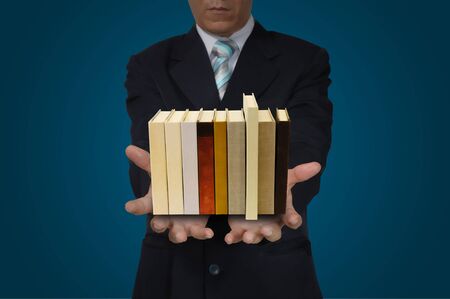 Stack of Book in Hand of Business Manの写真素材