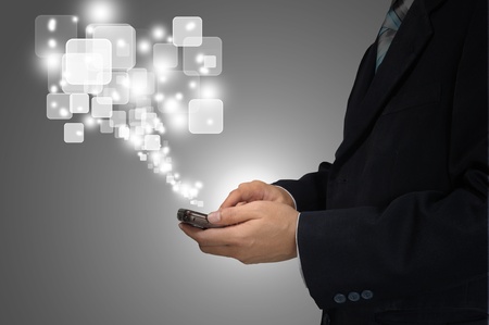 Hand of Business Man Pressing or Pushing touch screen of Mobile Smartphoneの写真素材