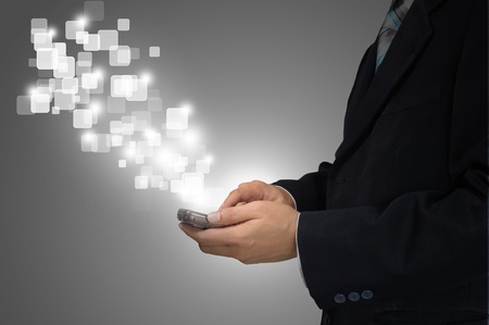 Hand of Business Man Pressing or Pushing touch screen of Mobile Smartphoneの写真素材
