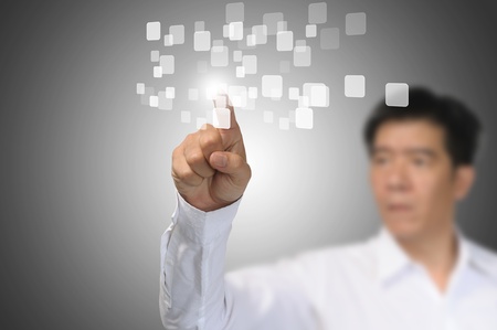 Business Man Pressing or Pushing on touch screen button or interfaceの写真素材