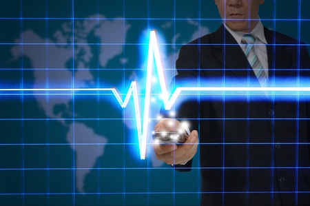 Business Man hold smart phone with digital heart pulseの写真素材