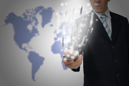 Business Man hold smartphone send the business dataの写真素材