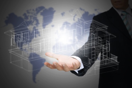 Hand of Business Man Hold 3D architect or home planの写真素材