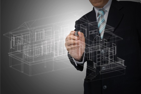 Hand of Business Man Draw 3D architect or home planの写真素材