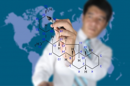 Male Teacher write science formula on blue backgroundの写真素材