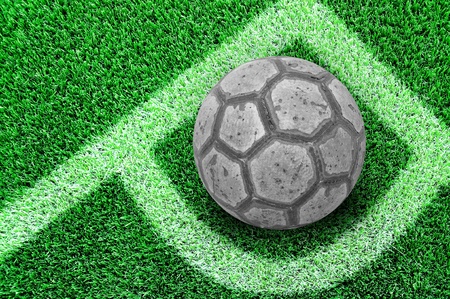 Football or soccer ball at the corner of artificial soccer fieldの写真素材
