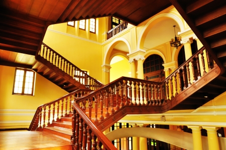 Wooden staircase in ancient building の写真素材