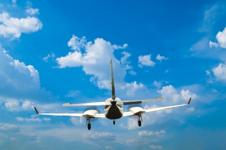 Airplane flying with blue skyの写真素材