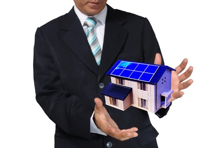 Business Man holding house or homeの写真素材