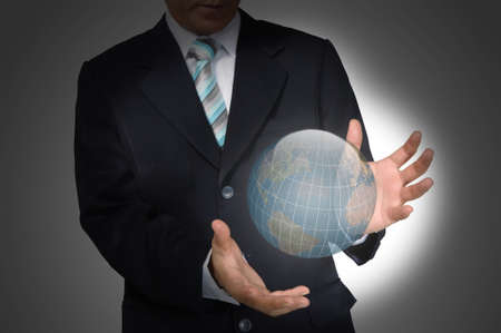 Business Man holding earth globe  Elements of this image furnished by NASAの写真素材