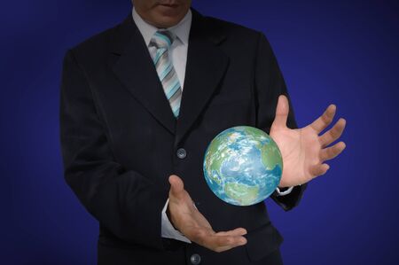 Business Man holding earth globe の写真素材