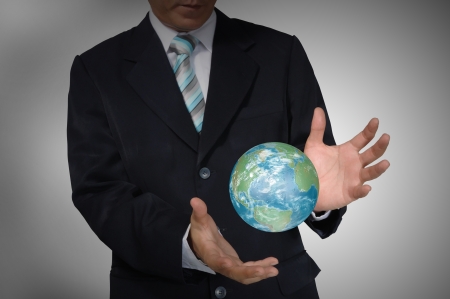 Business Man holding earth globe の写真素材