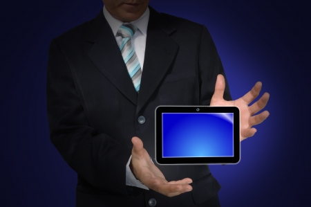 Hand of business Man holding Touch screen tablet PCの写真素材