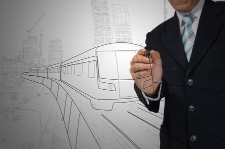Business Man or architect drawing train or transportationの写真素材