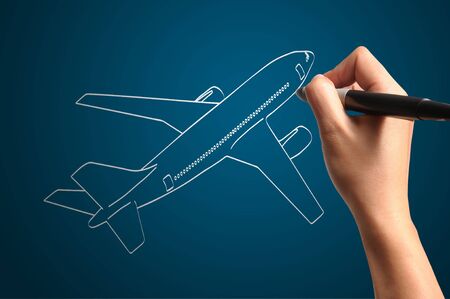 Male Hand drawing airplane の写真素材