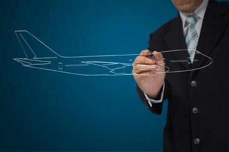 Business Male Hand drawing airplane の写真素材