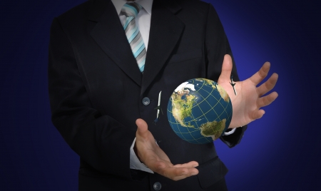 Business Man holding earth globeの写真素材