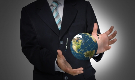 Business Man holding earth globeの写真素材