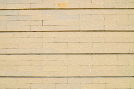 Closeup sand stone brick wall の写真素材