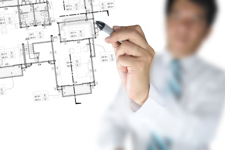Hand of Business Man or Architect Draw architectural home planの写真素材