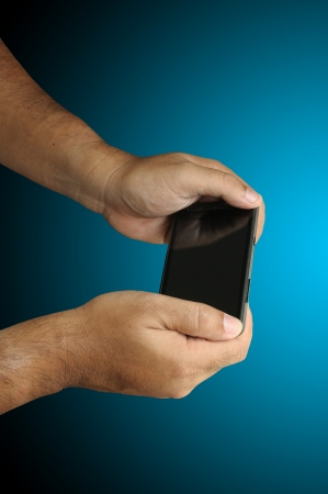Isolated Hand of Business man hold smart phone with clipping pathの写真素材