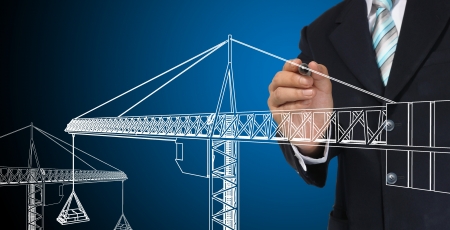 Business man drawing tower craneの写真素材