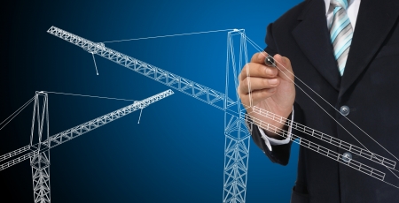 Business man drawing tower craneの写真素材