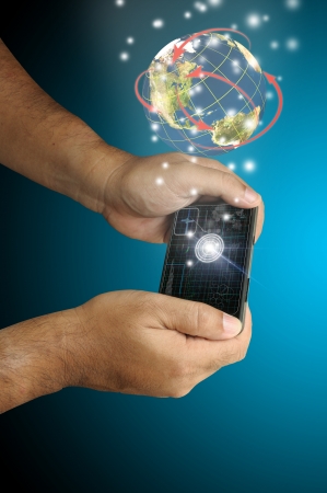 Hand of Business man touch smart phone with virtual digital network interface or environmentの写真素材