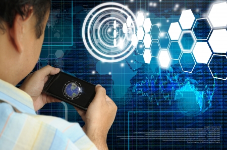 Hand of Business man hold smartphone with virtual digital interface の写真素材