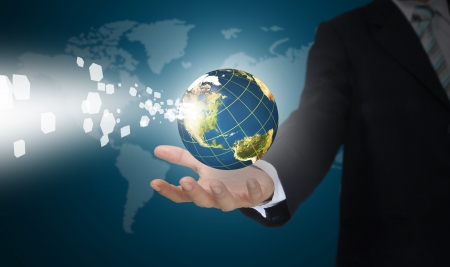 Business Man Holding Earth globe with digital Dataの写真素材