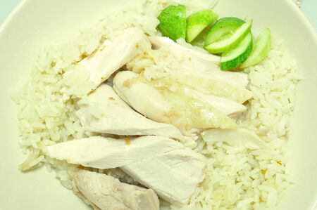 sliced Hainan-style chicken with marinated rice and sauce (Hainanese chicken rice) の写真素材