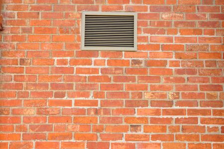 Brick Wall with Ventilator or Air ductの写真素材