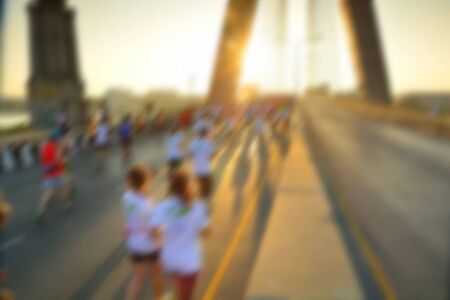 Blurred or defocus image of People in Marathon race for use as backgroundの写真素材