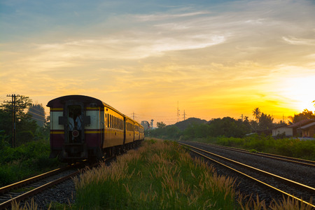 Train Running over Rural Railway in the Morning or at Dawn with Sunrise