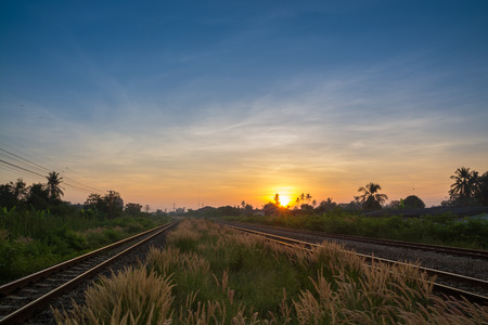Railway tracks in a Rural Scene with Nice Sunriseの写真素材