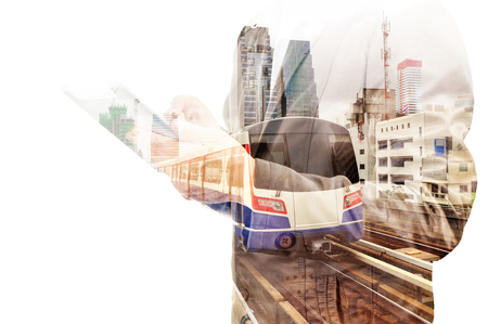 Double Exposure of Business Man use tablet and Skytrain or Subway as Modern City Transportation or Business Travel concept.の写真素材