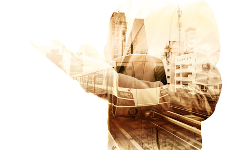 Double Exposure of Business Man use tablet and Skytrain or Subway as Modern City Transportation or Business Travel concept.の写真素材